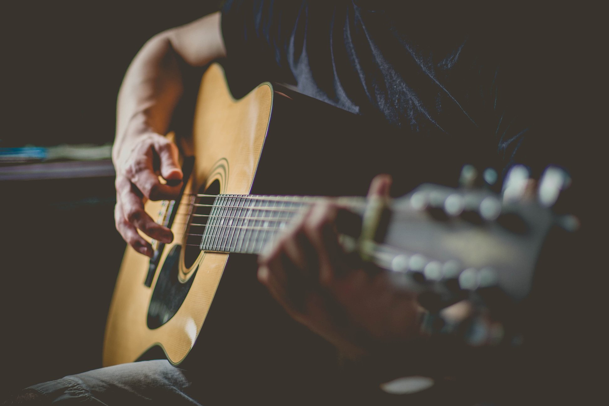 Man Playing An Acoustic Guitar